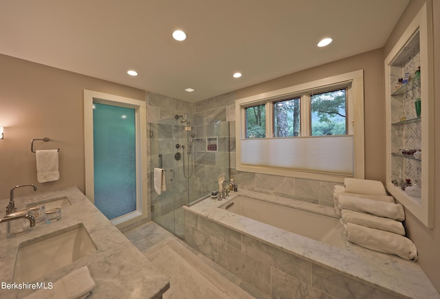 bathroom featuring vanity and separate shower and tub