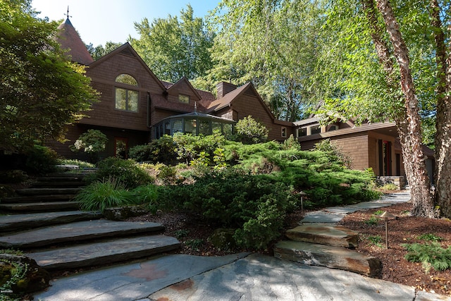 view of front of home with a sunroom