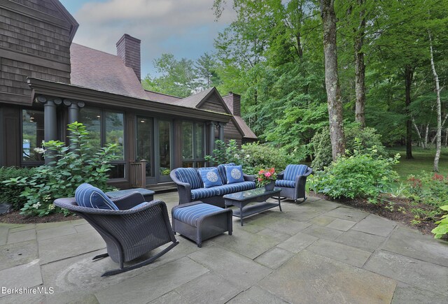 patio terrace at dusk with an outdoor living space