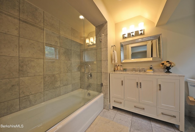 bathroom with vanity, tile patterned floors, lofted ceiling, and bath / shower combo with glass door