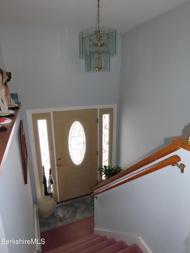 entrance foyer with a notable chandelier and stairway