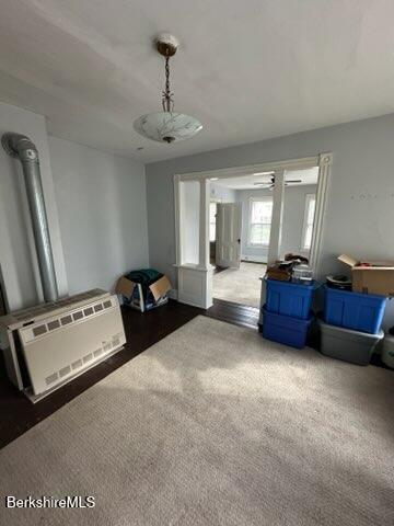 unfurnished living room featuring carpet flooring