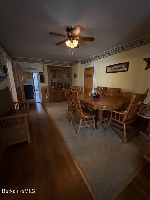 dining area featuring hardwood / wood-style floors and ceiling fan