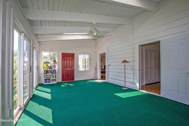 unfurnished sunroom featuring lofted ceiling with beams and ceiling fan