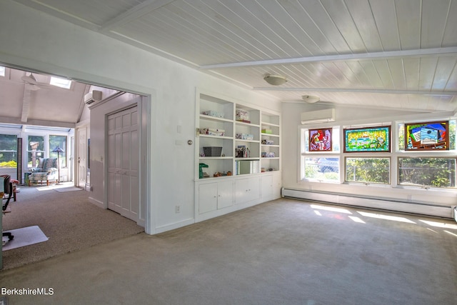 empty room with a healthy amount of sunlight, built in features, a baseboard heating unit, a wall unit AC, and carpet