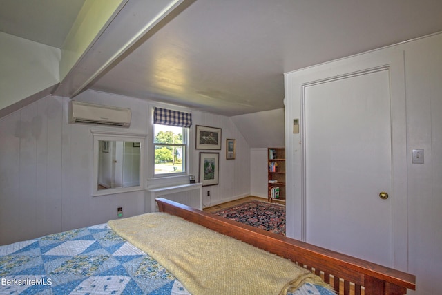 bedroom with a wall mounted AC and vaulted ceiling