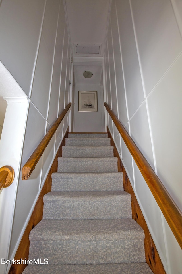 stairs with hardwood / wood-style floors