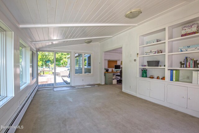 carpeted empty room with lofted ceiling, built in features, and a baseboard heating unit