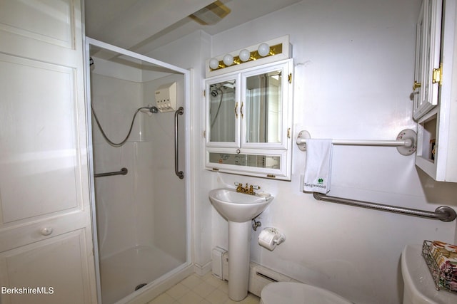 bathroom with toilet and a shower