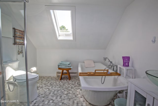 bathroom with a bathing tub, toilet, baseboard heating, and lofted ceiling with skylight