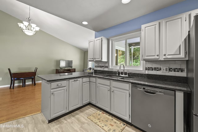 83 Bradley St, North Adams, MA 01247 - kitchen featuring stainless steel dishwasher, a peninsula, backsplash, light wood-style flooring, and white cabinets