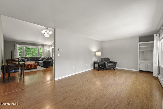 83 Bradley St, North Adams, MA 01247 - sitting room featuring wood finished floors and a chandelier