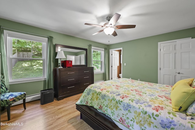 83 Bradley St, North Adams, MA 01247 - bedroom featuring a baseboard radiator, light wood-type flooring, and a ceiling fan