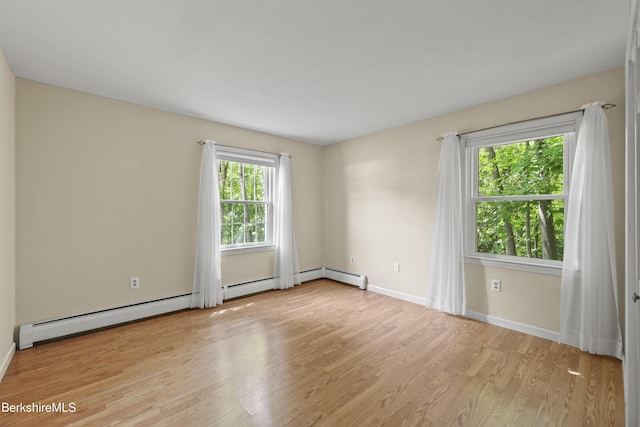 83 Bradley St, North Adams, MA 01247 - unfurnished room with light wood-style floors and a baseboard radiator
