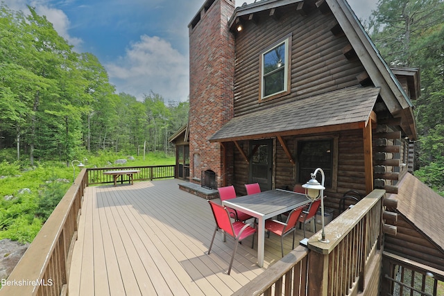 235 Algerie Rd, Becket, MA 01223 - deck featuring outdoor dining area and a wooded view