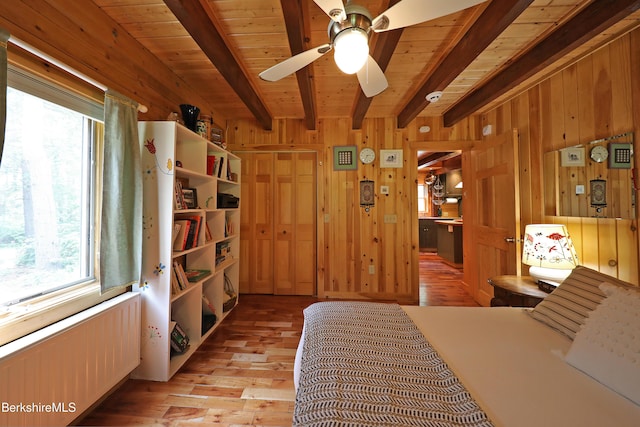 235 Algerie Rd, Becket, MA 01223 - bedroom featuring radiator heating unit, wood walls, light wood-type flooring, and a wooden ceiling with exposed beams