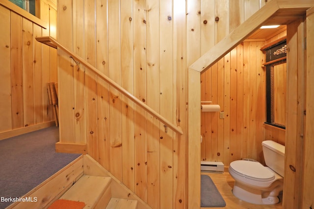 235 Algerie Rd, Becket, MA 01223 - stairs with baseboard heating and wood walls