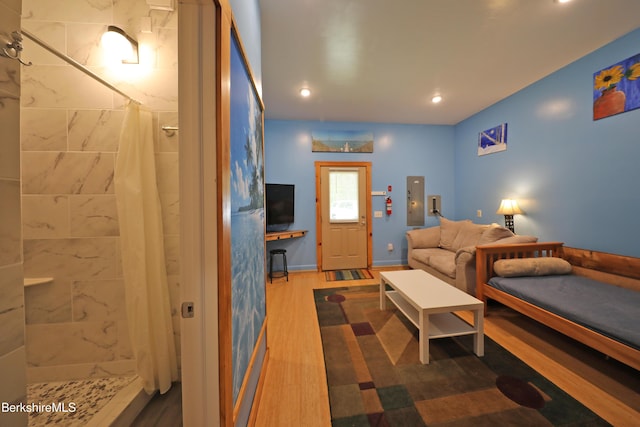 235 Algerie Rd, Becket, MA 01223 - bedroom featuring wood finished floors, ensuite bath, electric panel, and recessed lighting