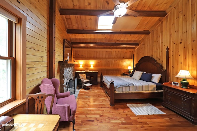 235 Algerie Rd, Becket, MA 01223 - bedroom featuring wood walls, wood ceiling, wood finished floors, and a stone fireplace