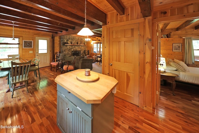 235 Algerie Rd, Becket, MA 01223 - kitchen with wood counters, open floor plan, wood walls, beam ceiling, and plenty of natural light