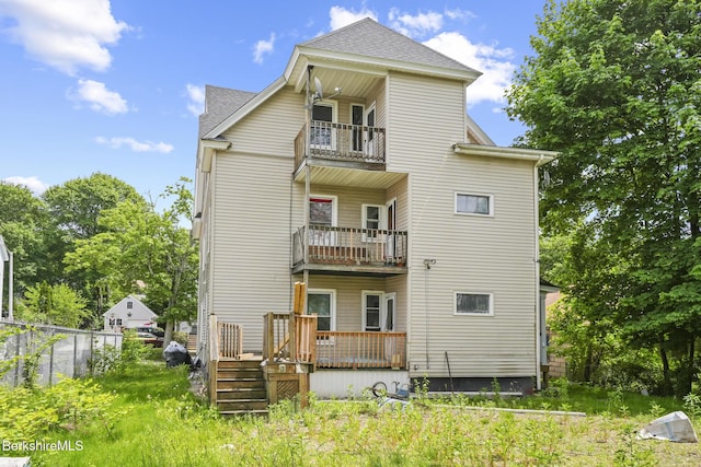 23 Ashton St, Worcester, MA 01604 - back of property featuring a balcony and a shingled roof