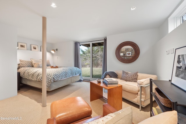 bedroom featuring access to exterior and carpet flooring