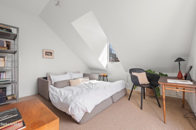 bedroom with carpet and lofted ceiling