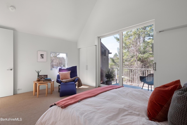 carpeted bedroom featuring high vaulted ceiling and access to exterior