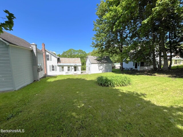 22 Marietta St, North Adams, MA 01247 - view of green lawn featuring a shed