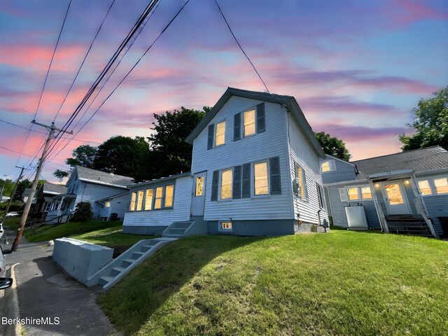 22 Marietta St, North Adams, MA 01247 - view of front of home featuring entry steps and a front lawn