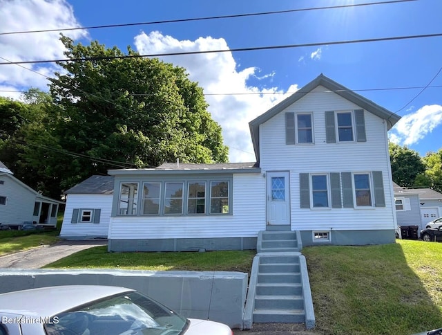 22 Marietta St, North Adams, MA 01247 - traditional-style home with a front lawn and entry steps