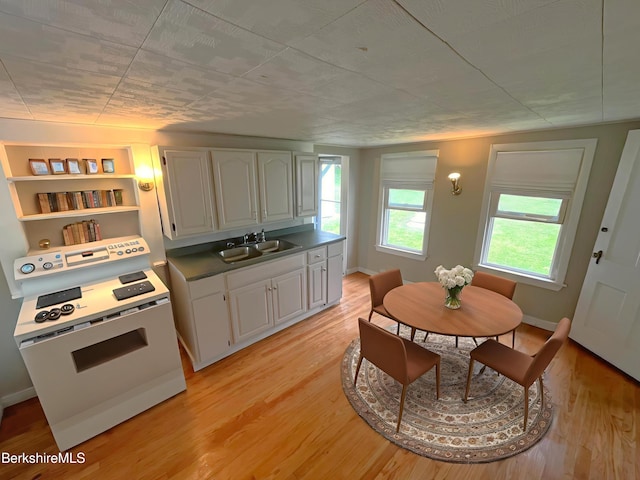 22 Marietta St, North Adams, MA 01247 - kitchen with light wood-style flooring, white cabinets, and white electric stove