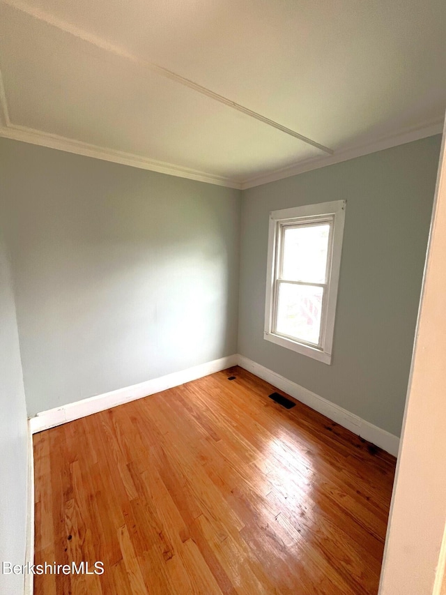 22 Marietta St, North Adams, MA 01247 - empty room featuring ornamental molding and wood finished floors