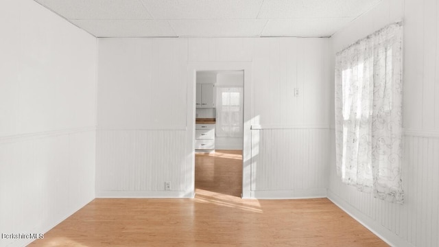 spare room with wood finished floors