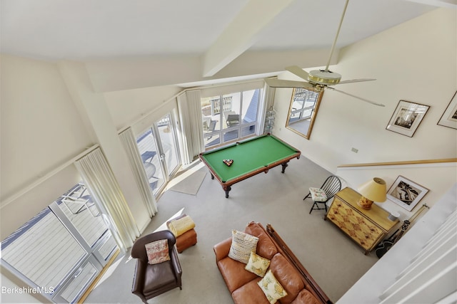 game room with beamed ceiling, pool table, and ceiling fan