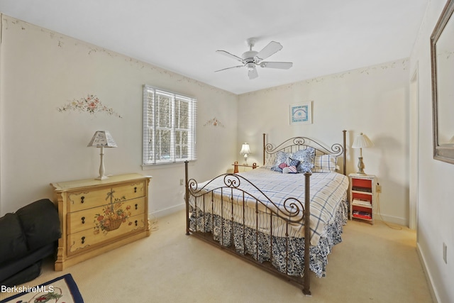 bedroom featuring ceiling fan and light carpet