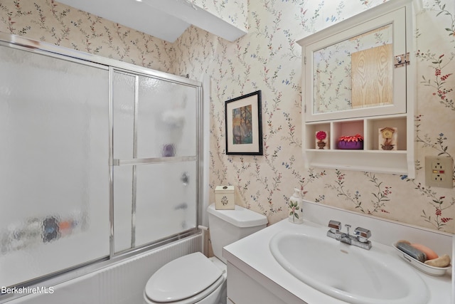 full bathroom with vanity, shower / bath combination with glass door, and toilet