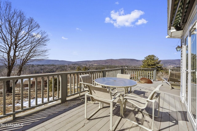 wooden terrace featuring a mountain view