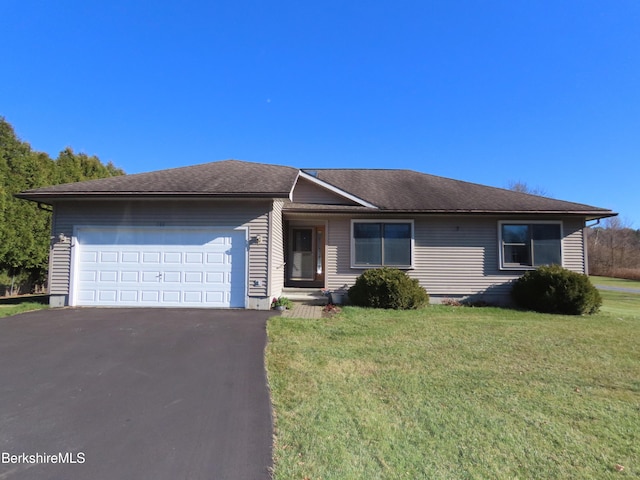 single story home with an attached garage, driveway, a front yard, and roof with shingles