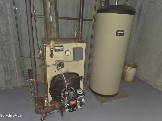 utility room featuring water heater and a heating unit