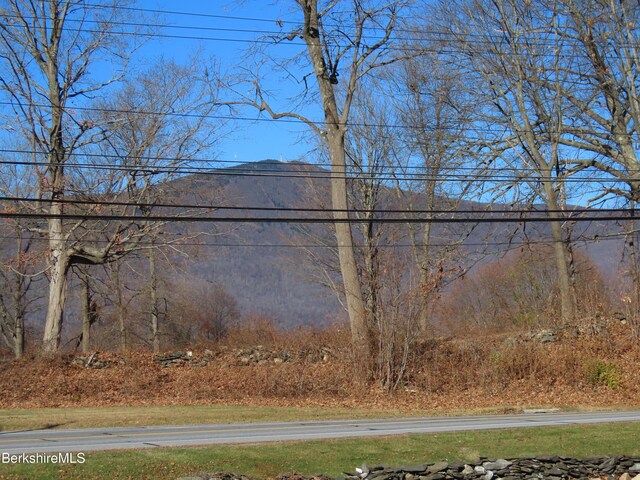 view of side of property featuring a mountain view