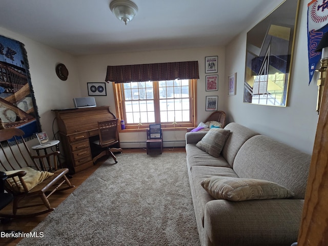 office space with a baseboard heating unit and wood finished floors