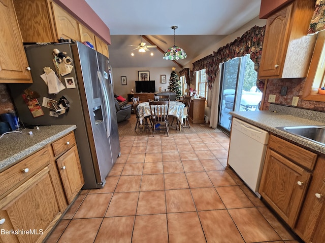 kitchen featuring stainless steel refrigerator with ice dispenser, white dishwasher, ceiling fan, hanging light fixtures, and light tile patterned flooring