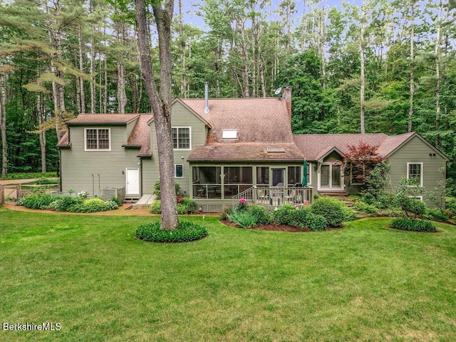 351 Adsit Crosby Rd, New Marlborough, MA 01244 - rear view of house with a sunroom, a lawn, and a chimney