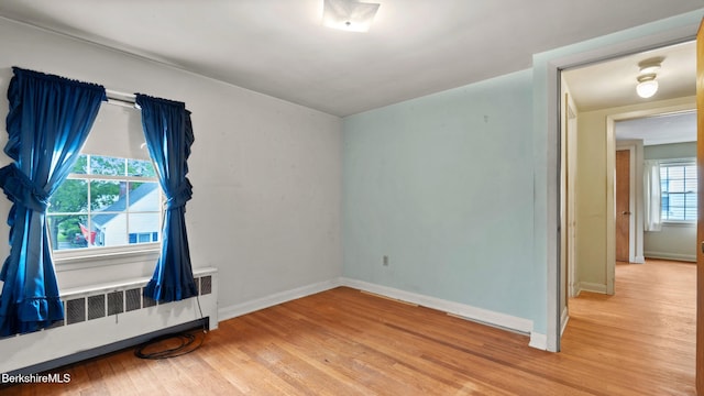 202 Park Ave, Dalton, MA 01226 - spare room with radiator heating unit and light wood-type flooring