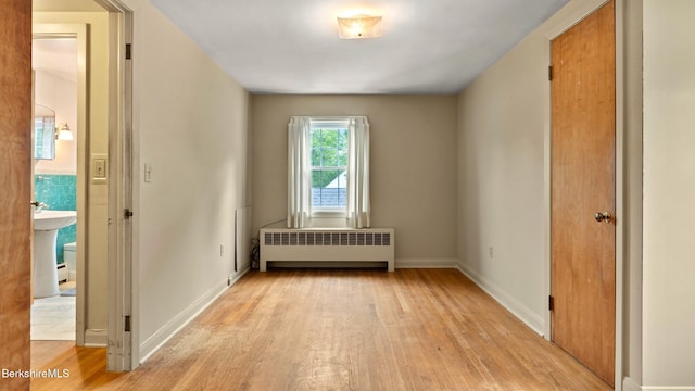 202 Park Ave, Dalton, MA 01226 - empty room with radiator and light wood-style flooring