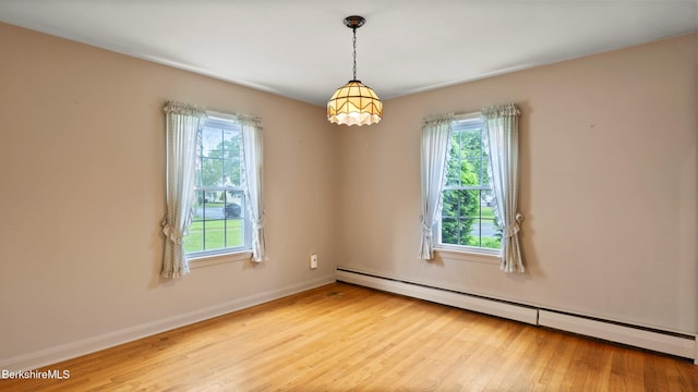 202 Park Ave, Dalton, MA 01226 - unfurnished room with baseboard heating, plenty of natural light, and wood finished floors