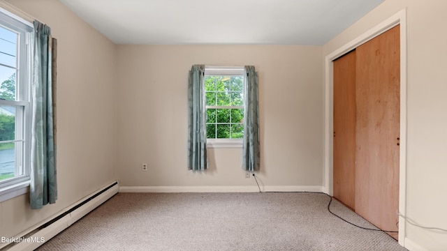 202 Park Ave, Dalton, MA 01226 - unfurnished bedroom featuring baseboard heating, carpet floors, and a closet
