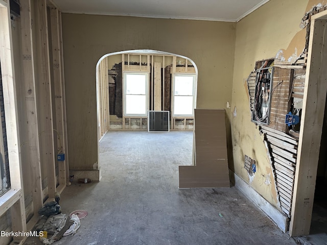 empty room featuring ornamental molding