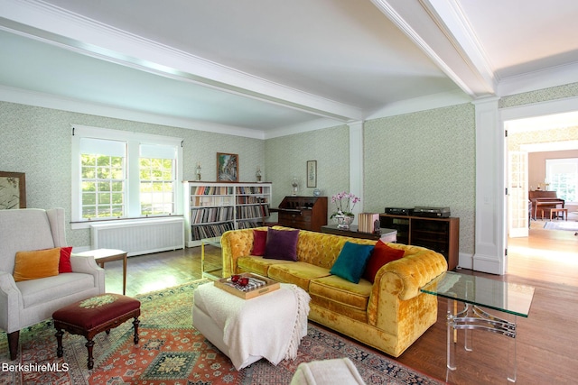 82 W Ave, Great Barrington, MA 01230 - living area with wood finished floors, ornamental molding, radiator, plenty of natural light, and beamed ceiling